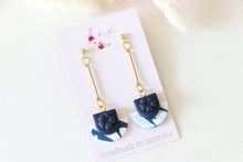 Load image into Gallery viewer, blue_flower_cup_dangle_handmade_earrings_up_view
