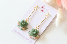 Load image into Gallery viewer, green_flower_cup_dangle_earrings_side_view