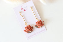 Load image into Gallery viewer, orange_brown_floral_cup_dangle_handmade_earrings_front_side_view