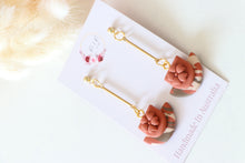 Load image into Gallery viewer, orange_brown_floral_cup_dangle_handmade_earrings_side_view