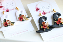 Load image into Gallery viewer, Witch Hat Polymer Clay Earrings – Handmade Halloween Earrings | Spooky Cute Statement Jewelry | KeandKi Designs (Black Flower)
