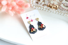 Load image into Gallery viewer, Pumpkin Floral Polymer Clay Earrings – Handmade Autumn Halloween Earrings | Fall Floral Jewelry | KeandKi Designs ( Tri color Black Red teracotta and beige Floral )

