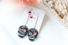 Load image into Gallery viewer, Floral Embossed Skull Floral Dangle Polymer Clay Earrings – Handmade Gothic Floral Earrings | Spooky Elegant Halloween Jewelry | KeandKi Designs
