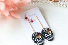 Load image into Gallery viewer, Floral Embossed Skull Floral Dangle Polymer Clay Earrings – Handmade Gothic Floral Earrings | Spooky Elegant Halloween Jewelry | KeandKi Designs
