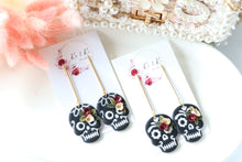 Load image into Gallery viewer, Embossed Skull Floral Dangle Polymer Clay Earrings – Handmade Gothic Floral Earrings | Spooky Elegant Halloween Jewelry | KeandKi Designs
