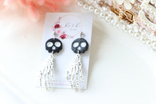 Load image into Gallery viewer, Tiny Skull Head &amp; Steel Skeletal Hand Dangle Earrings – Handmade Gothic Halloween Jewelry | Polymer Clay Skull Earrings | KeandKi Designs
