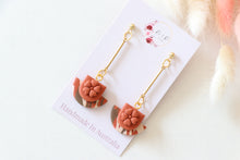 Load image into Gallery viewer, orange_brown_floral_cup_dangle_handmade_earrings_left_side_view
