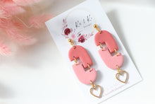 Load image into Gallery viewer, pink_geometric_arch_dangle_earrings_front_side_view_
