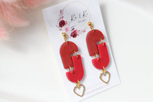 Load image into Gallery viewer, red_geometric_arch_dangle_earrings_top_view_
